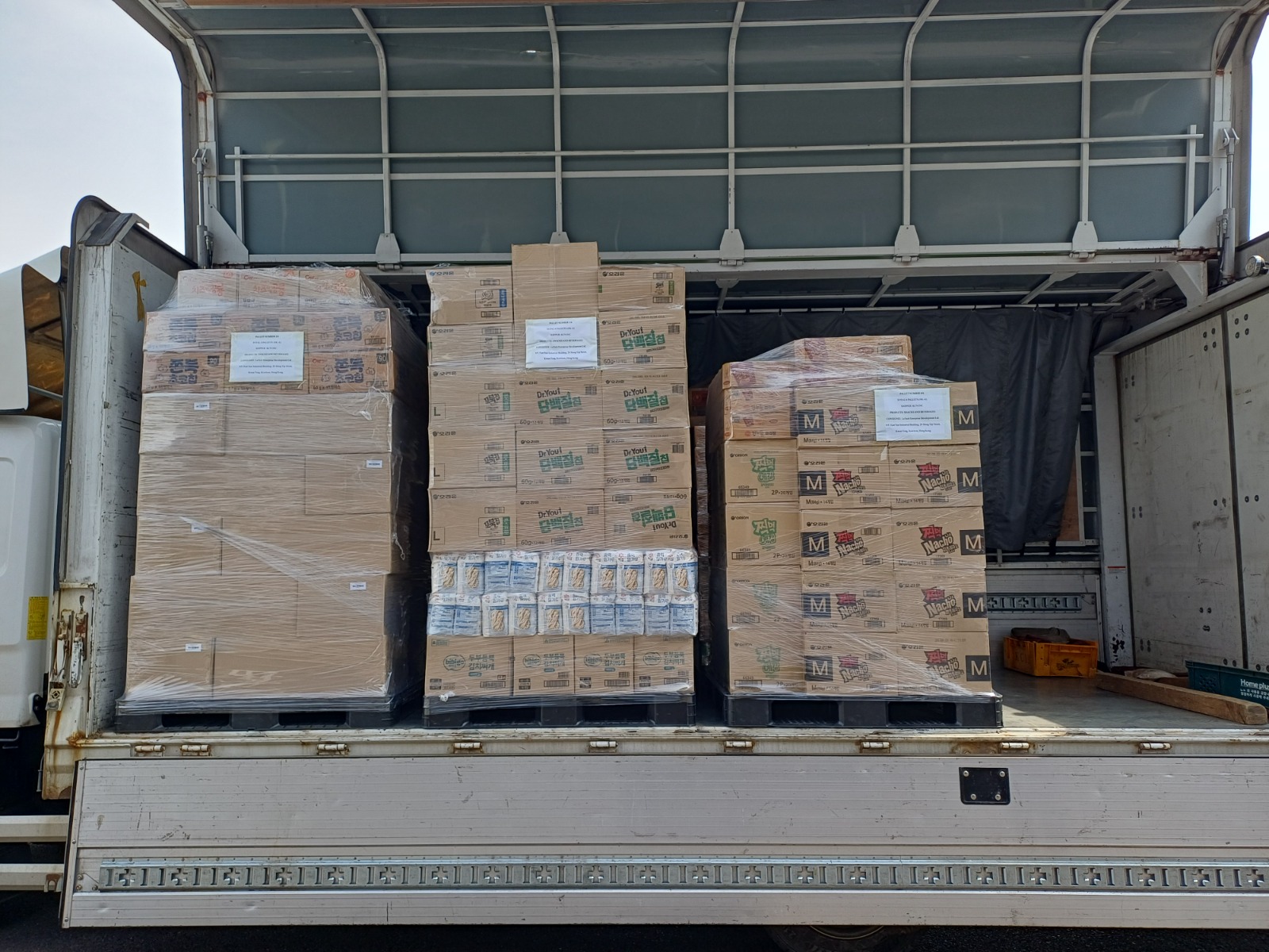 Korean food and beverage export pallets loaded on a truck